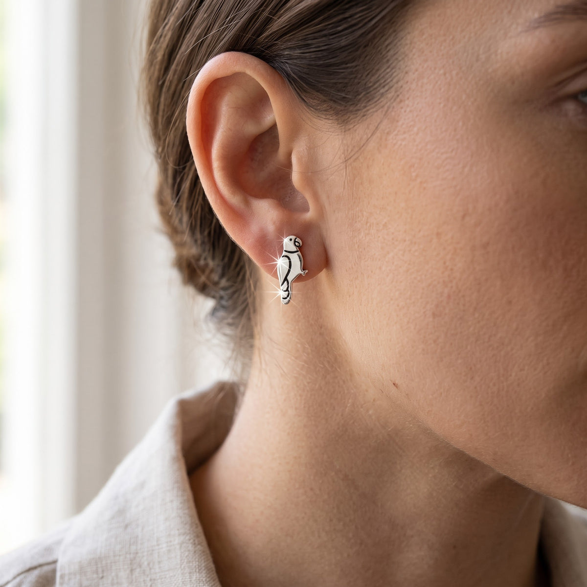 Sterling Silver Girls Dainty Bird Parrot Stud Earrings, 8mm worn, lifestyle photo