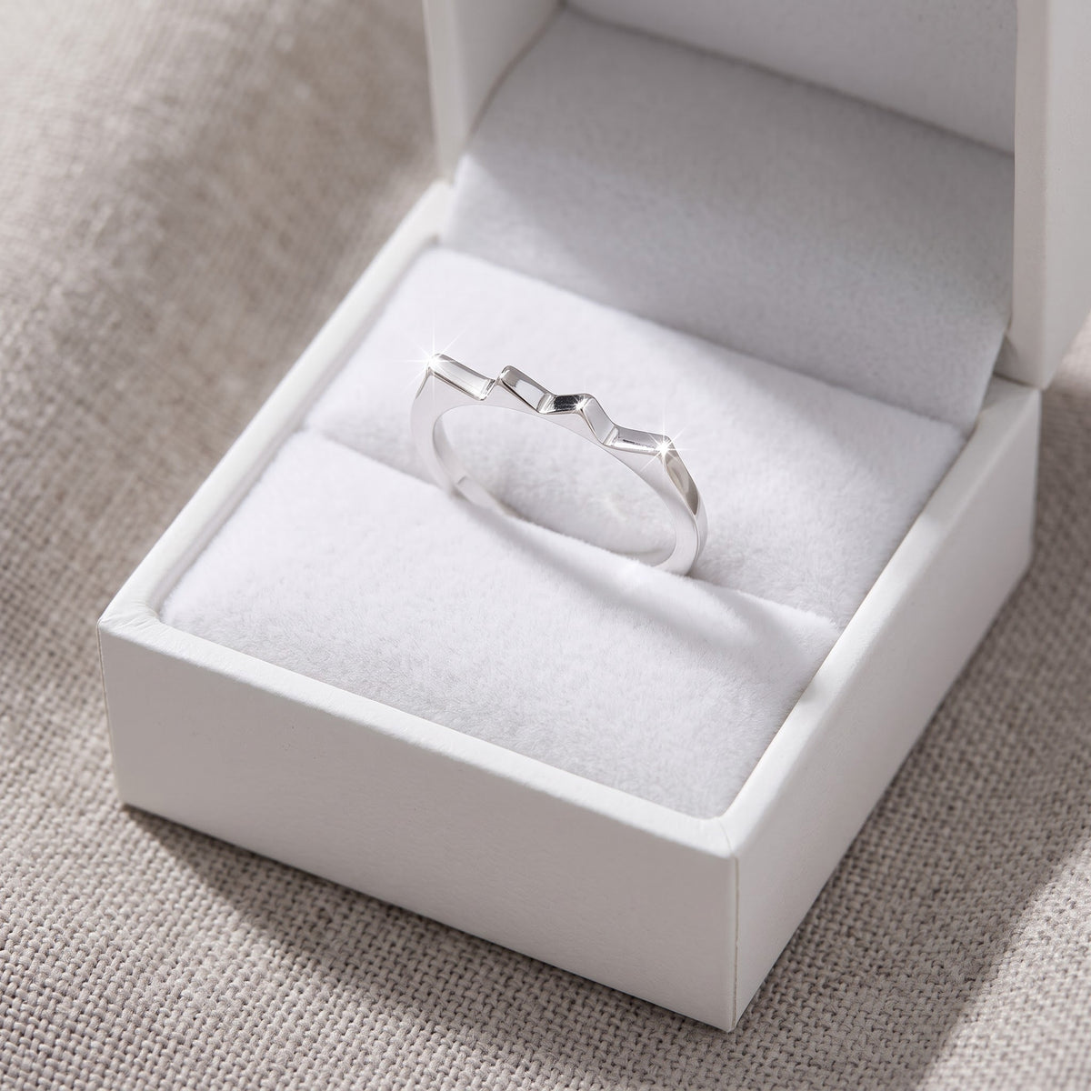 Sterling Silver Stackable Spike Ring 2mm in a white gift box, ready to give