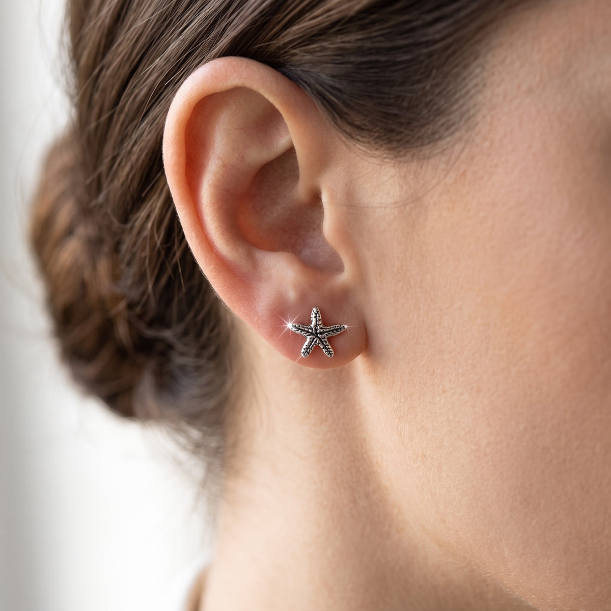 Sterling Silver Nautical Starfish Stud Earrings, 5mm worn, lifestyle photo