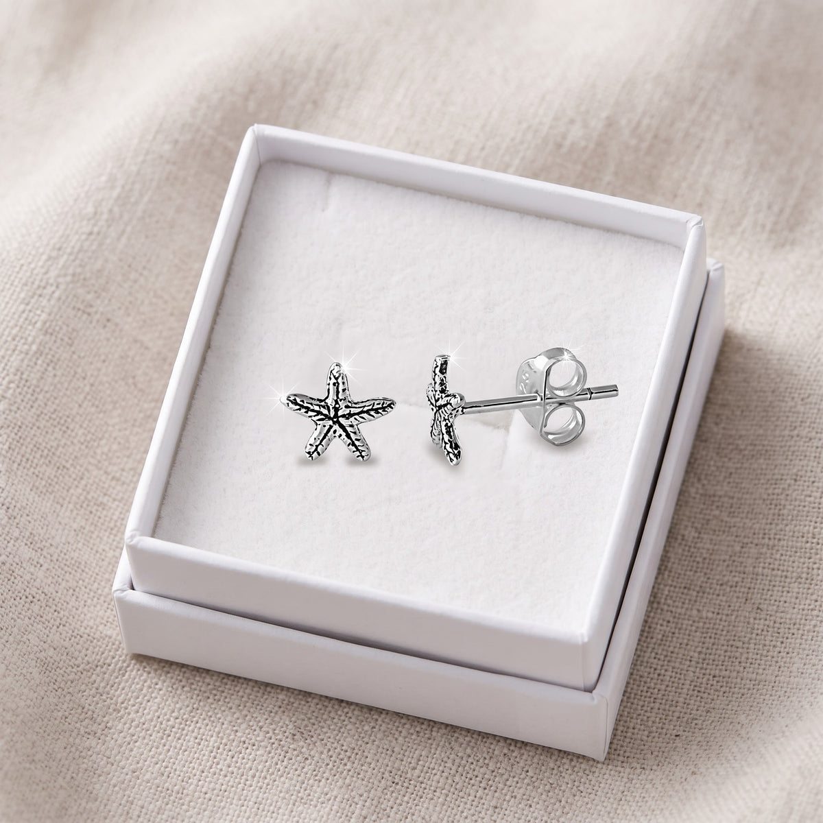 Sterling Silver Nautical Starfish Stud Earrings, 5mm in a white gift box, ready to give