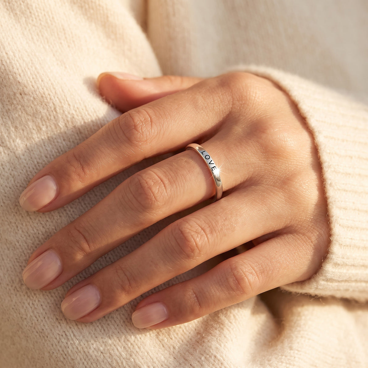 Sterling Silver Thin Stackable Love Ring worn, lifestyle photo