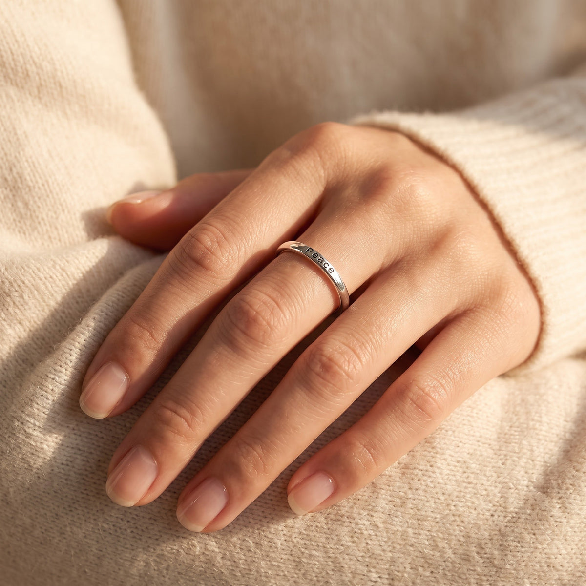 Sterling Silver Thin Stackable Peace Ring worn, lifestyle photo