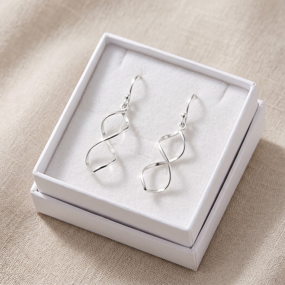 Sterling Silver Spiral Drop Dangle Earrings in a white gift box, ready to give