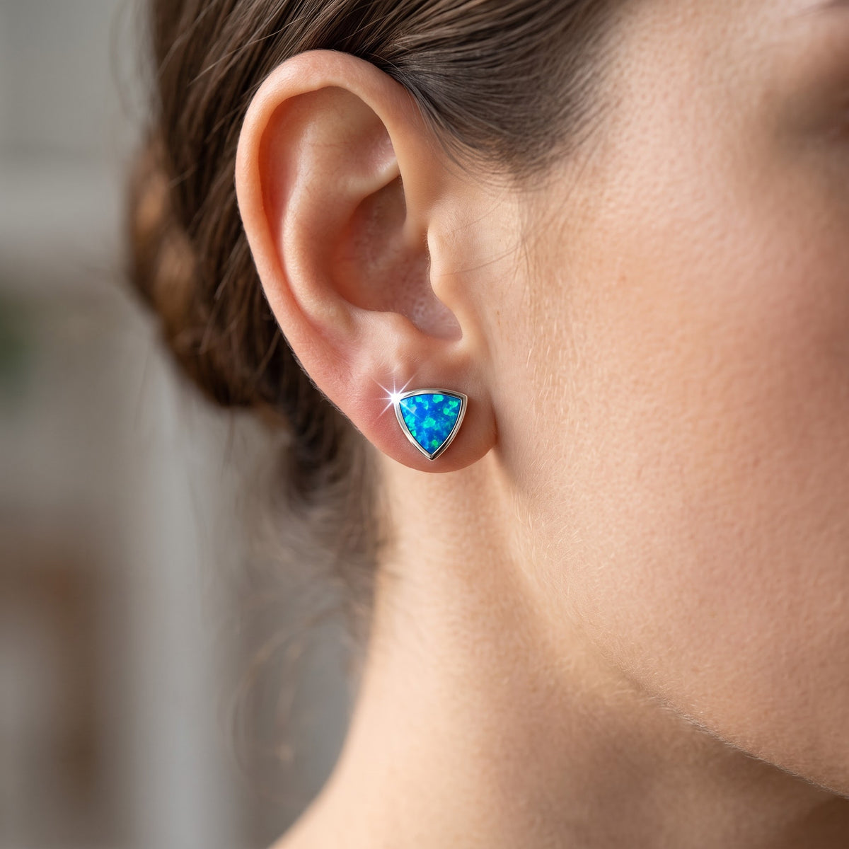 Sterling Silver Girls Created Blue Opal Triangle Stud Earrings worn, lifestyle photo