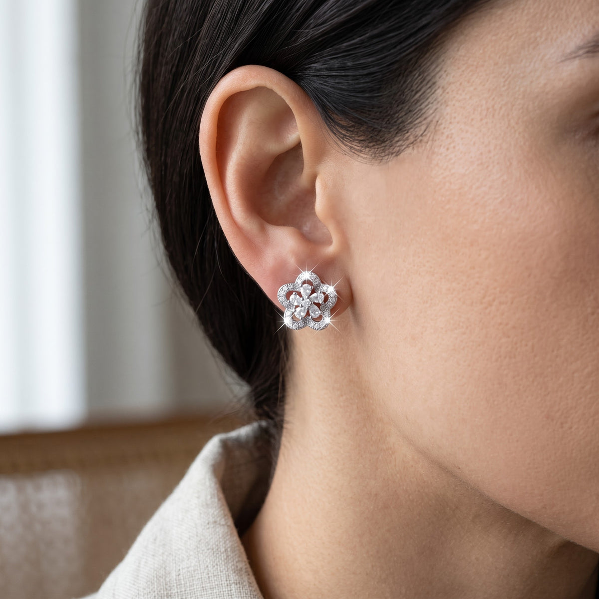 White Gold over Sterling Silver Women's CZ Halo Flower Stud Earrings worn, lifestyle photo