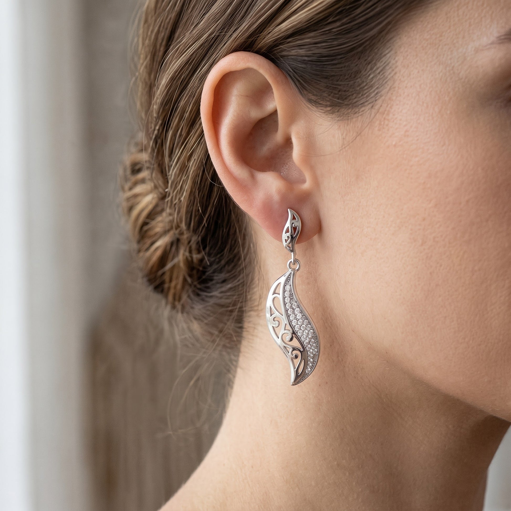 White Gold over Sterling Silver Women's CZ Intricate Leaf Dangle Earrings - 7mm worn, lifestyle photo