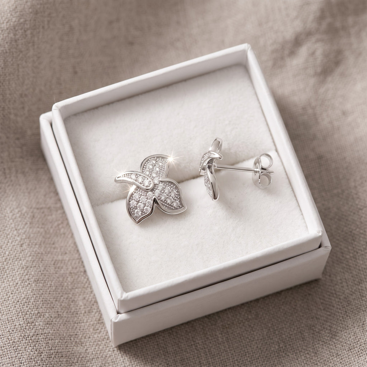 White Gold over Sterling Silver Women's CZ Ivy Leaf Stud Earrings in a white gift box, ready to give