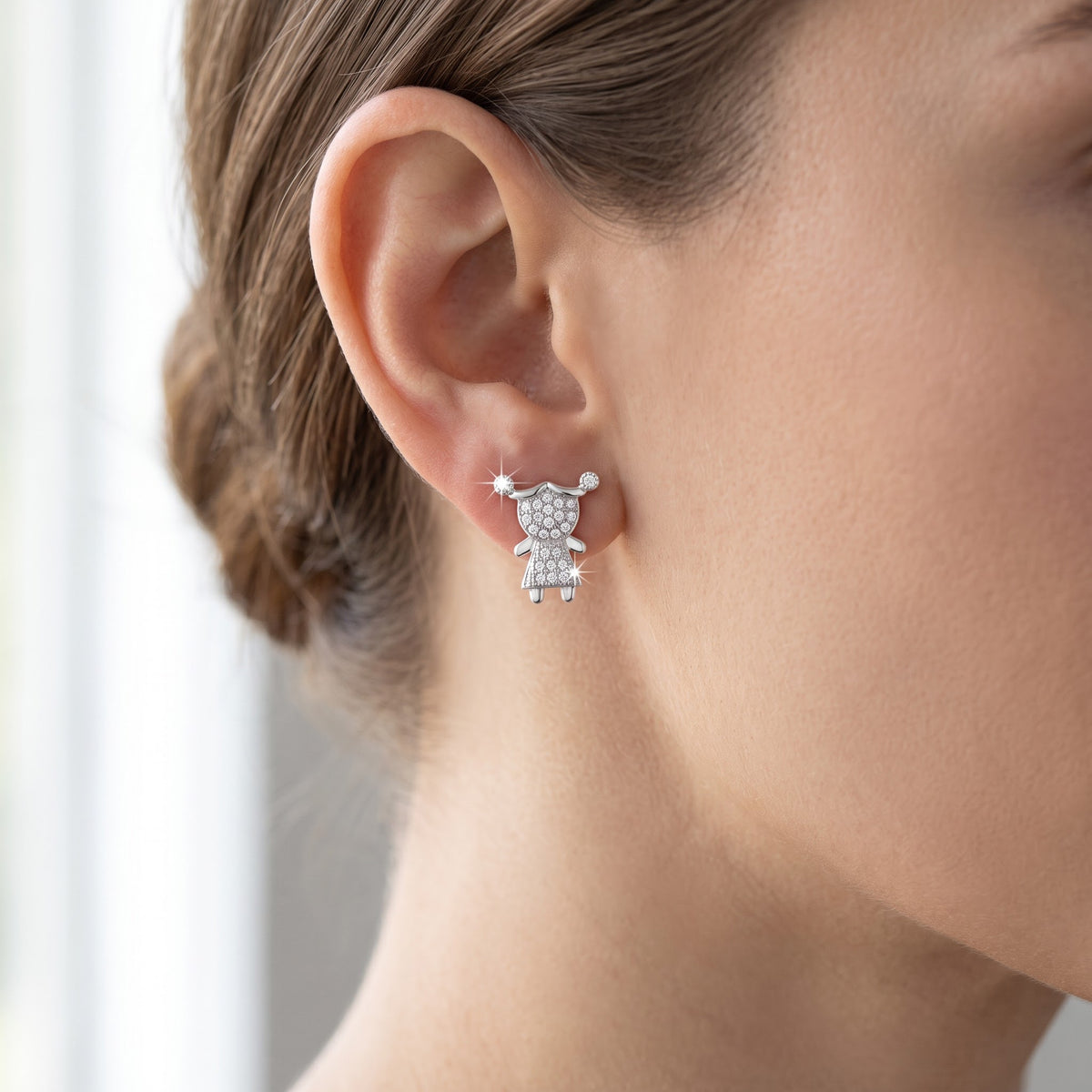 White Gold over Sterling Silver Women's CZ pigtail Girl Stud Earrings worn, lifestyle photo