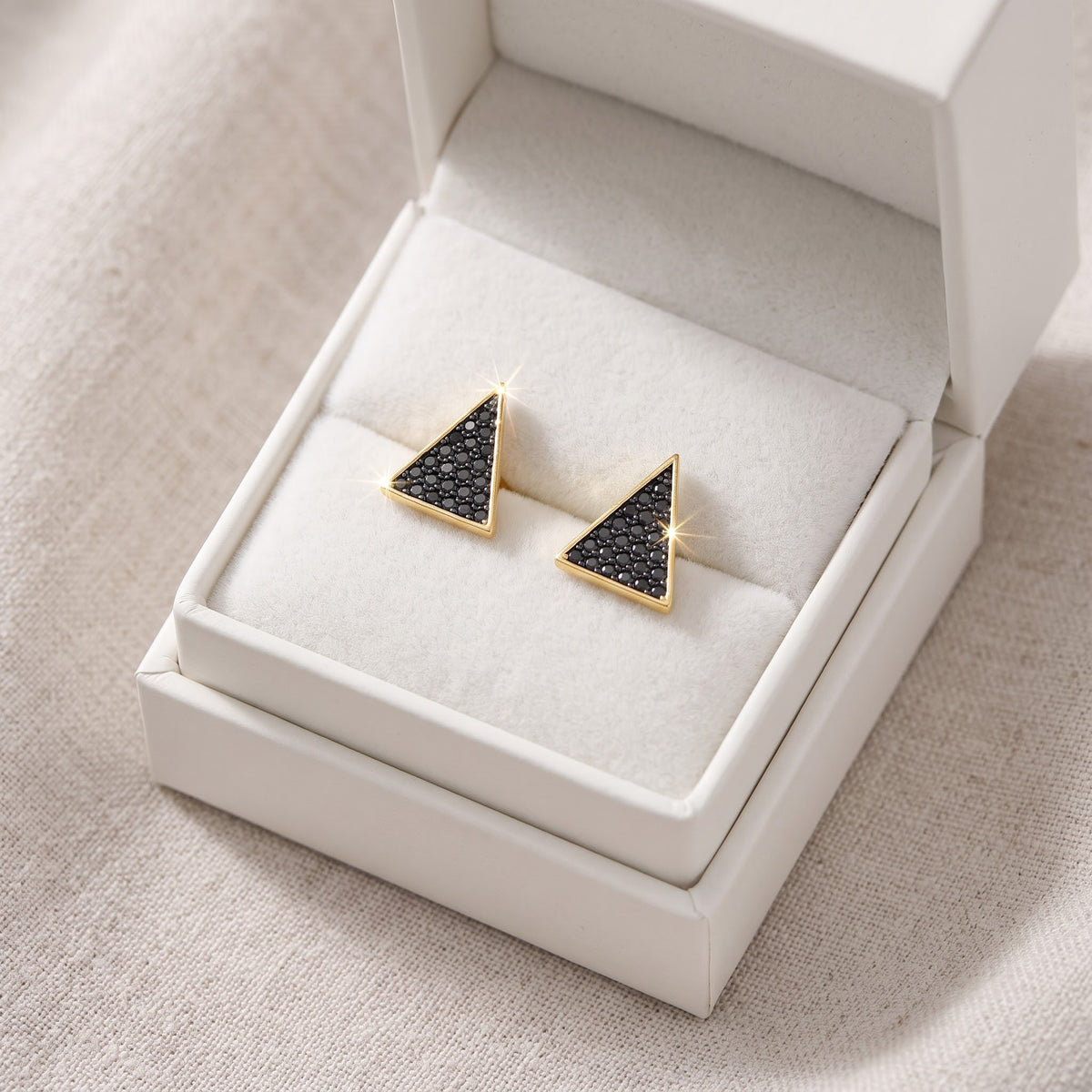 Yellow Gold over Sterling Silver Women's Black CZ Triangle Stud Earrings in a white gift box, ready to give