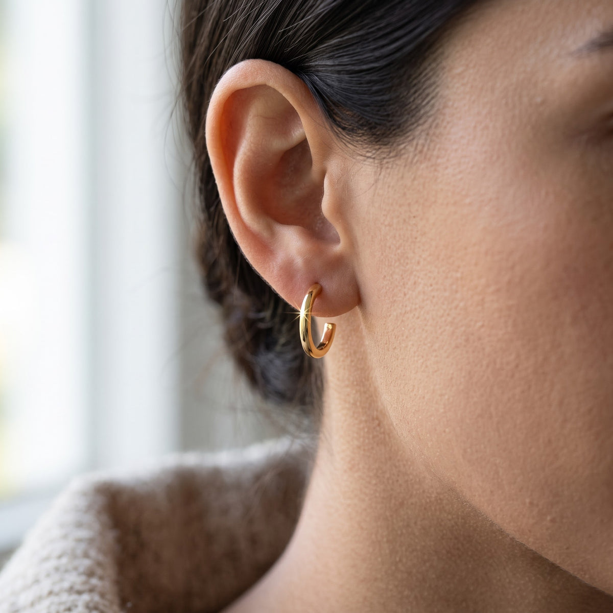 Yellow Gold Small Huggie Earrings, 11mm worn, lifestyle photo