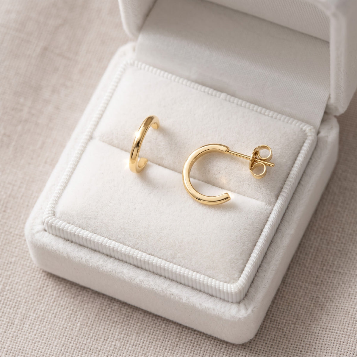 Yellow Gold Small Huggie Earrings, 11mm in a white gift box, ready to give