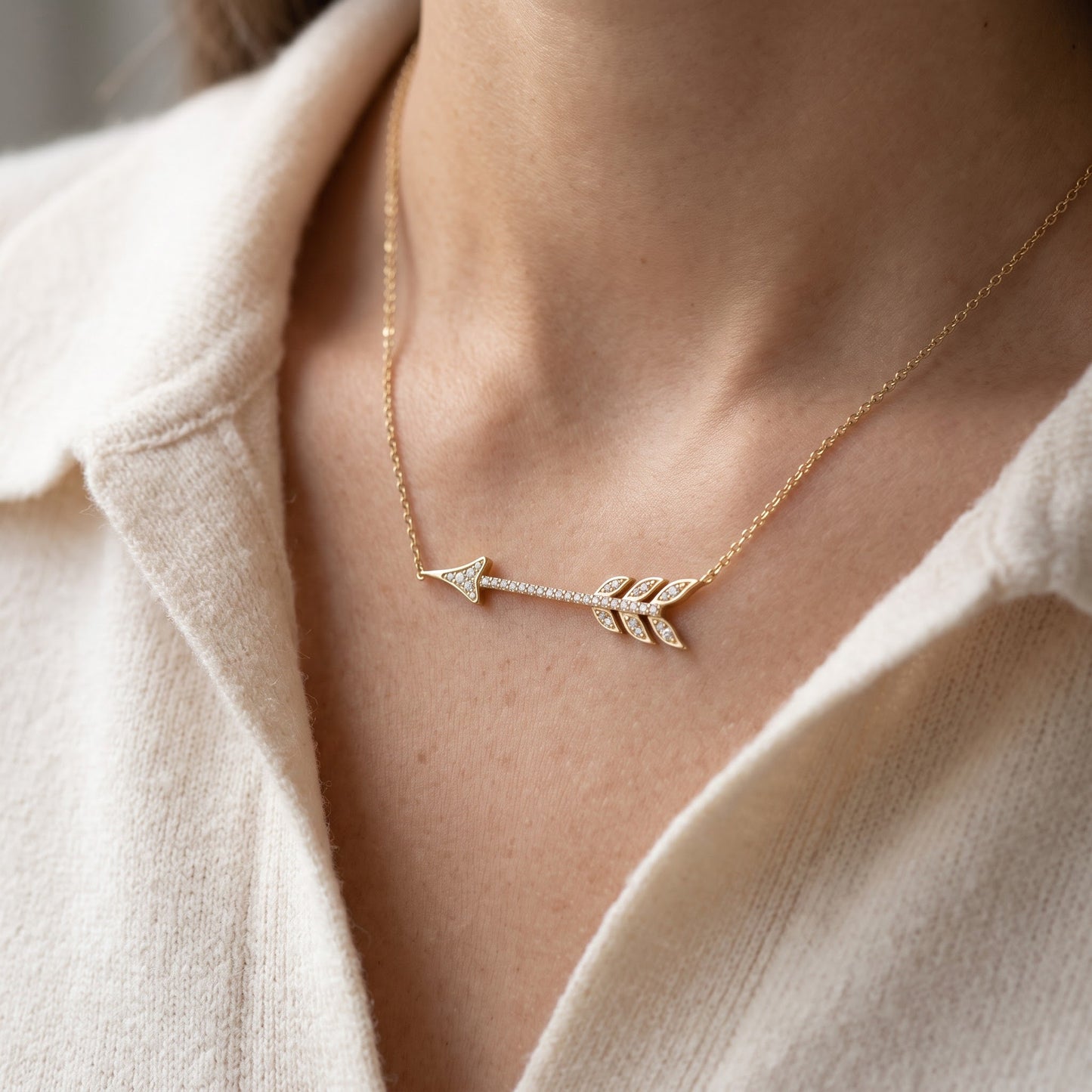 Yellow Gold Tone Sterling Silver CZ Sideways Arrow Necklace, 18" worn, lifestyle photo